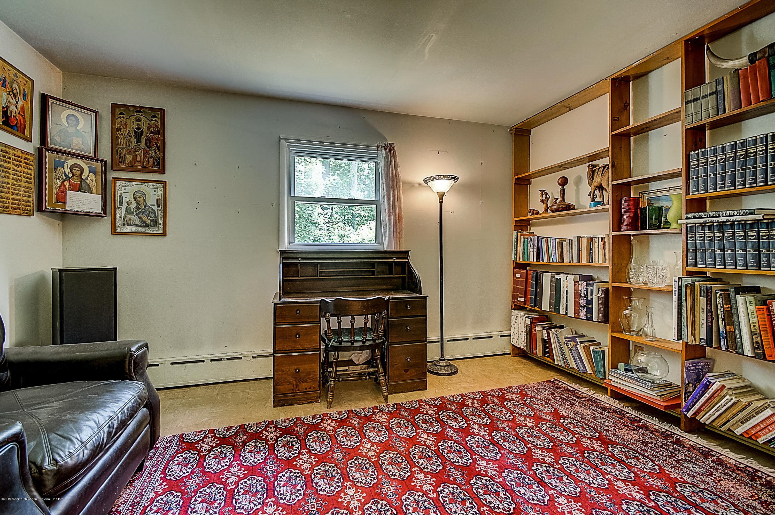 137 Pond Road Freehold, NJ 07728 - Photo 27 of 52 a bedroom with furniture and a book shelf