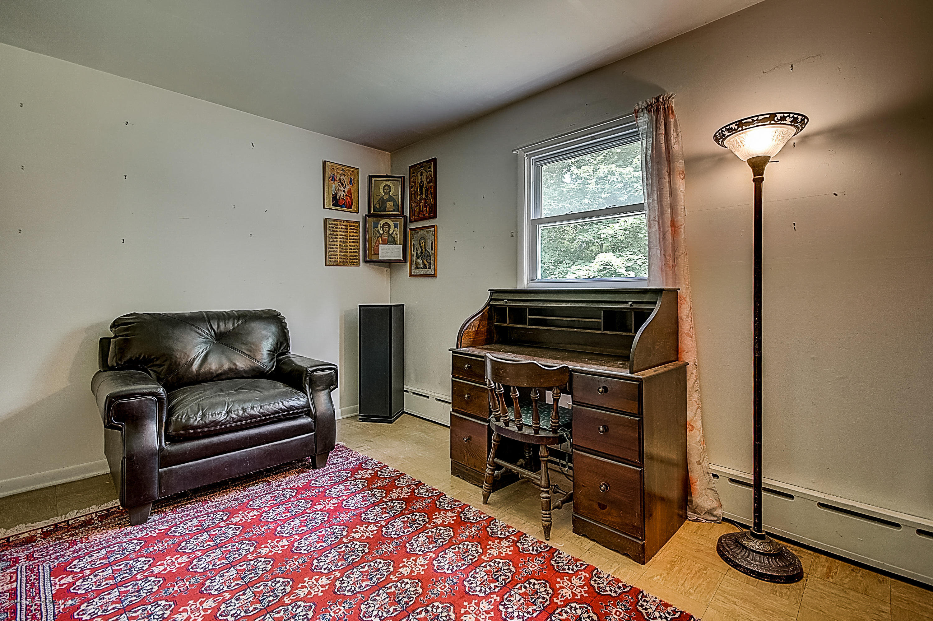 137 Pond Road Freehold, NJ 07728 - Photo 28 of 52 a living room with furniture a window and a flat screen tv