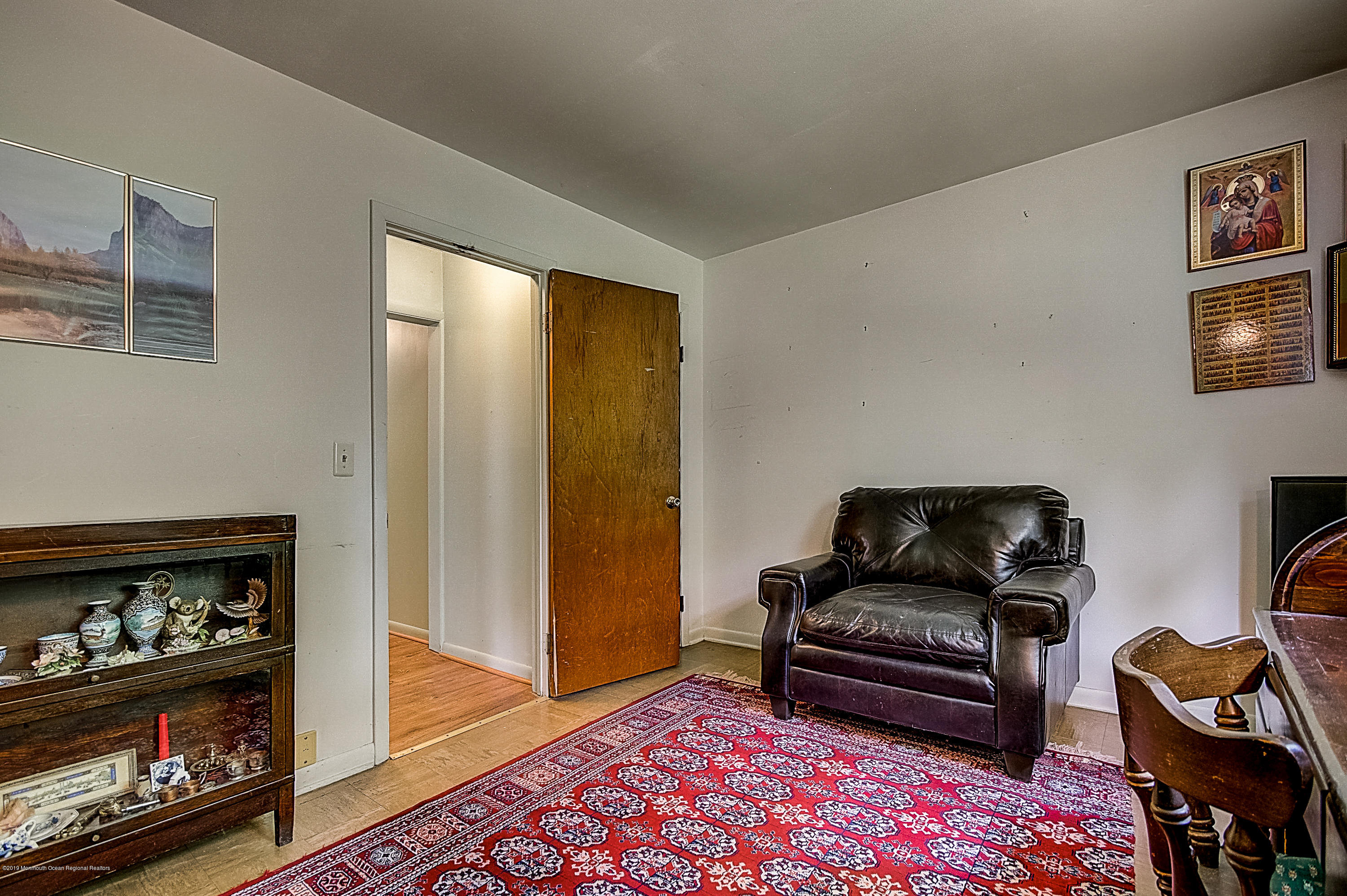 137 Pond Road Freehold, NJ 07728 - Photo 29 of 52 a living room with furniture and a window
