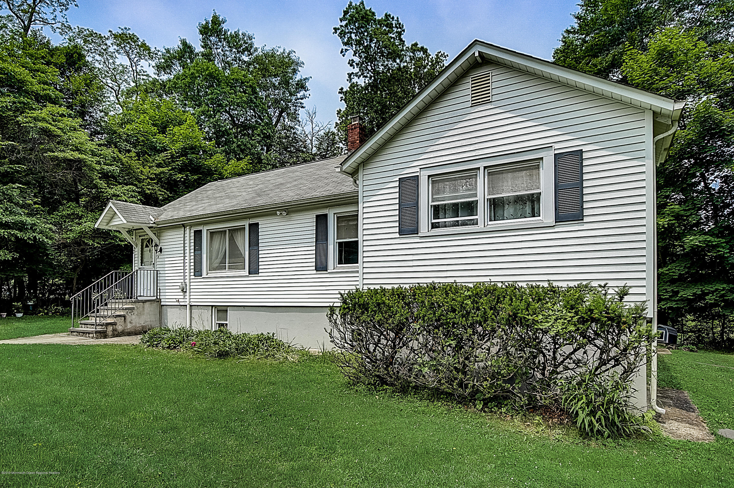 137 Pond Road Freehold, NJ 07728 - Photo 3 of 52 a front view of a house with a garden