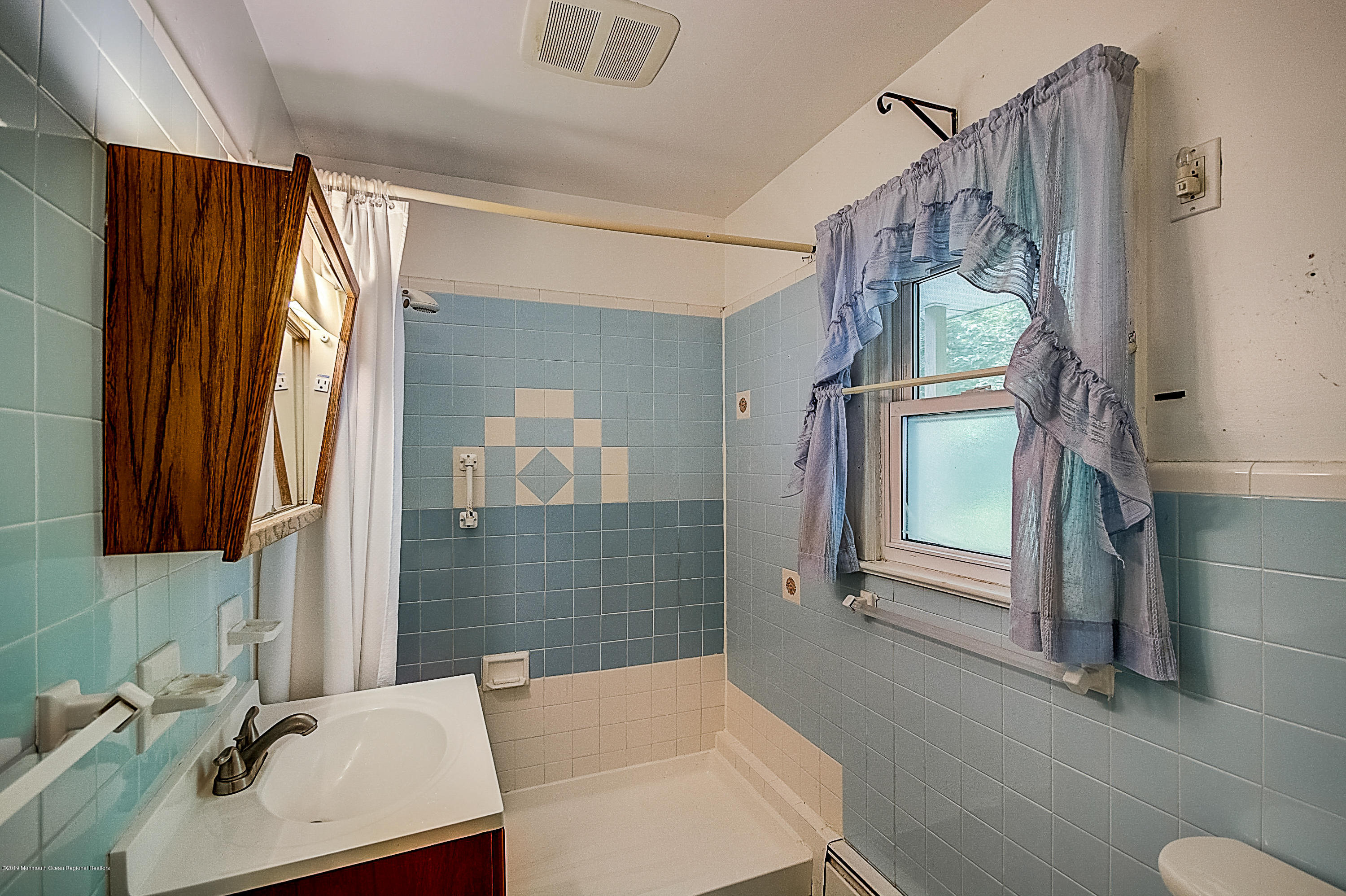 137 Pond Road Freehold, NJ 07728 - Photo 31 of 52 a bathroom with a sink toilet and shower
