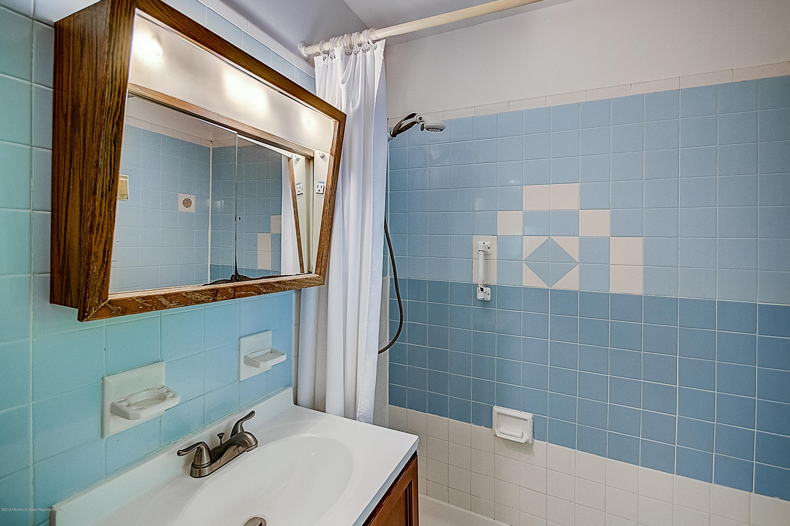 137 Pond Road Freehold, NJ 07728 - Photo 32 of 52 a bathroom with a sink a toilet and shower