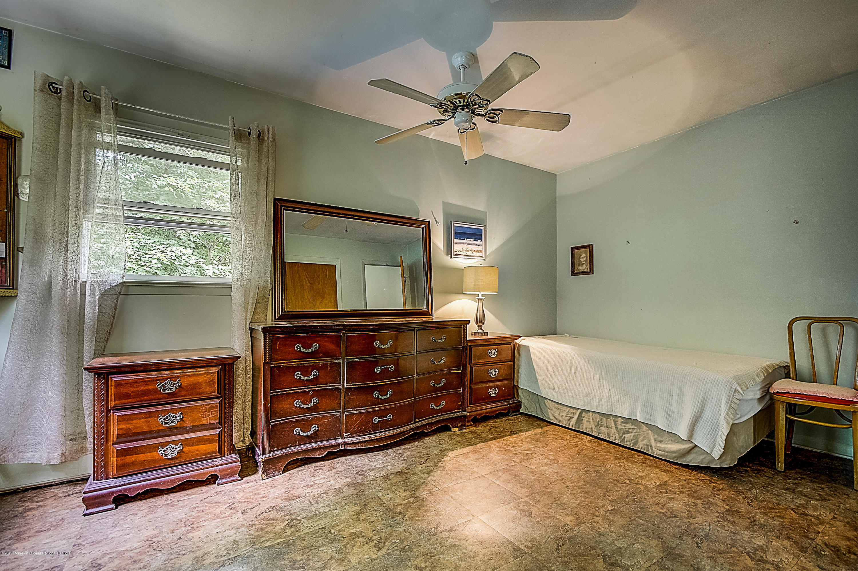 137 Pond Road Freehold, NJ 07728 - Photo 33 of 52 a bedroom with a bed and a dresser