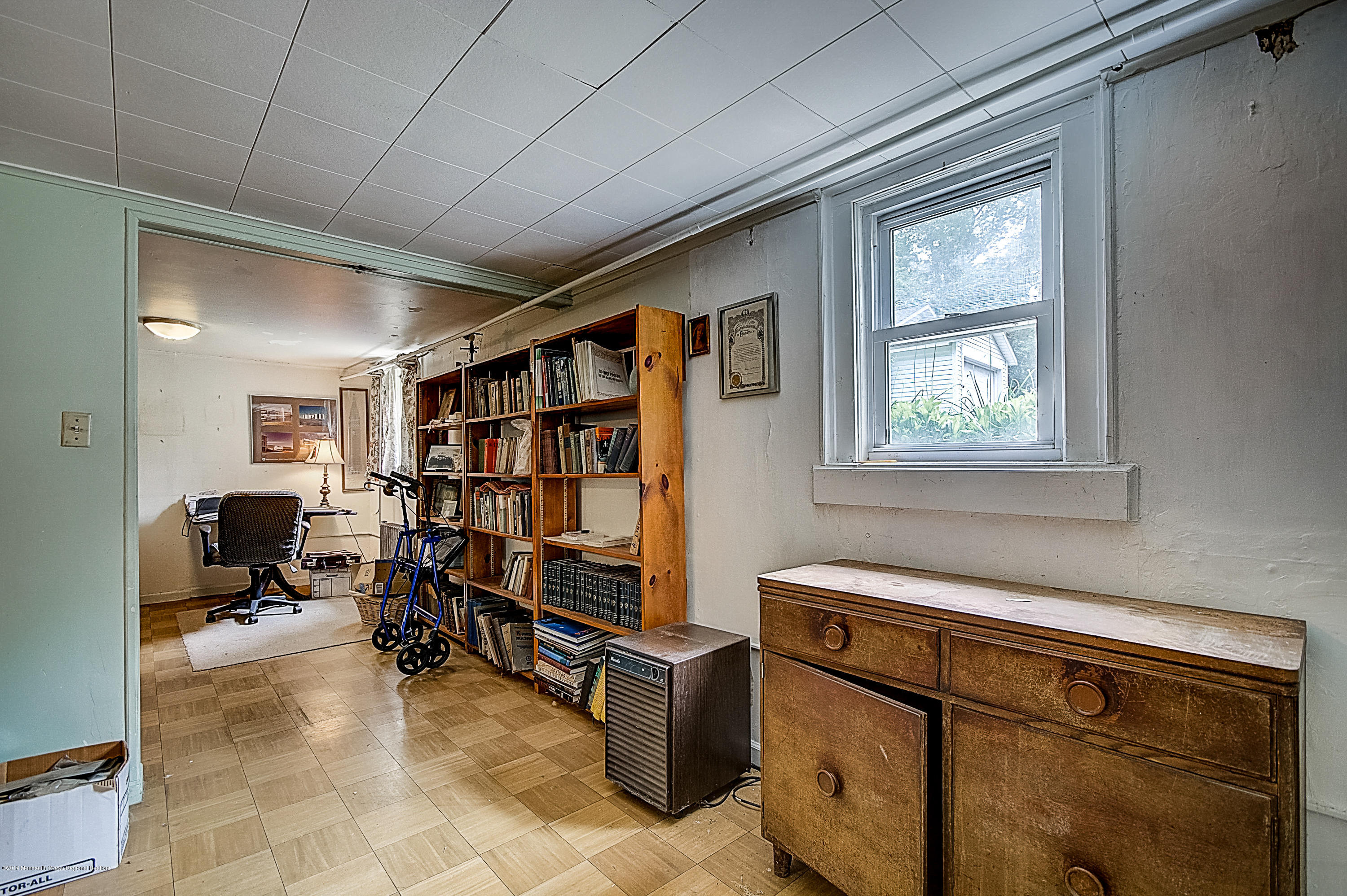 137 Pond Road Freehold, NJ 07728 - Photo 40 of 52 a livingroom with workspace and a window