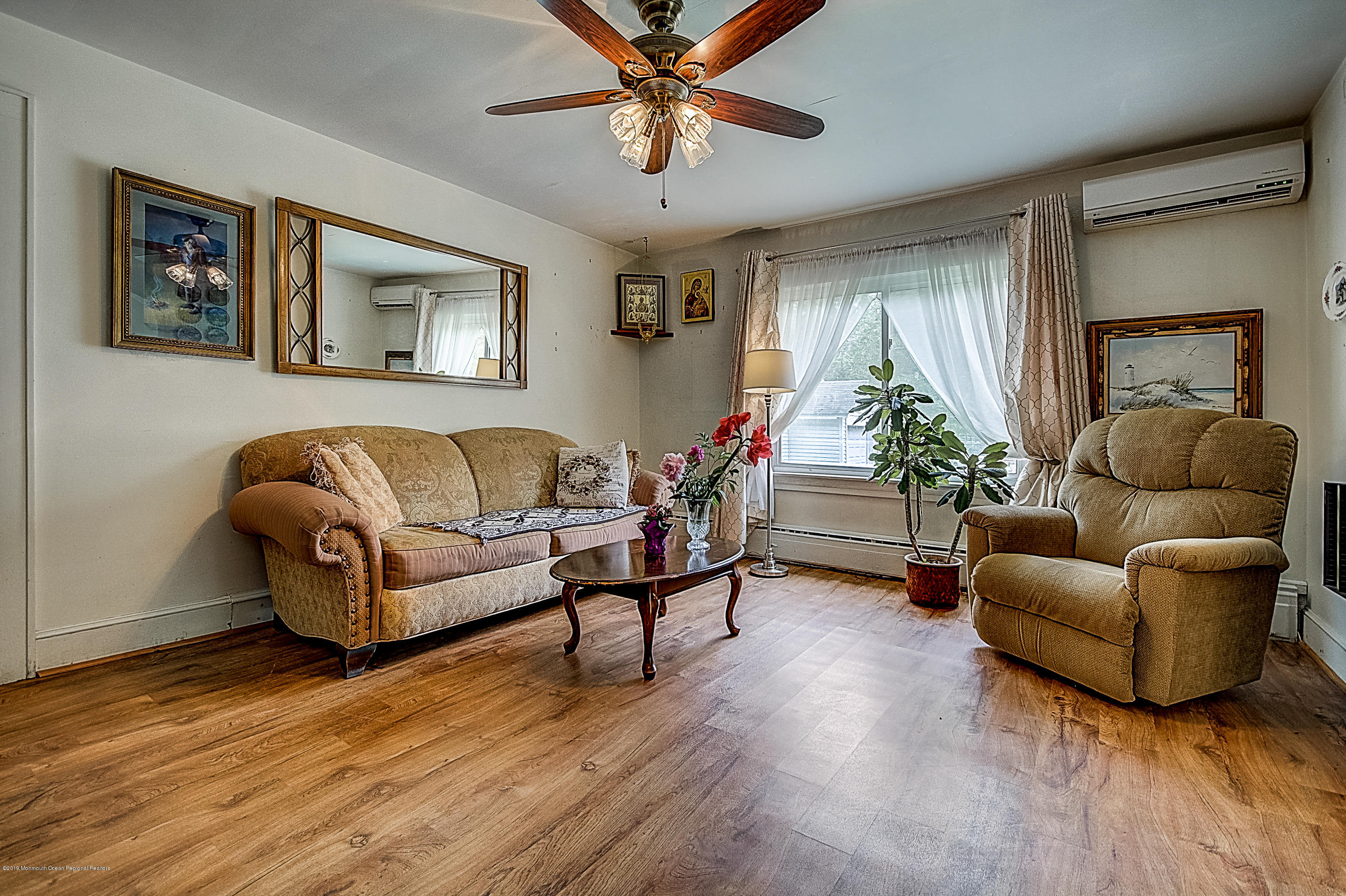 137 Pond Road Freehold, NJ 07728 - Photo 4 of 52 a living room with furniture and a large window