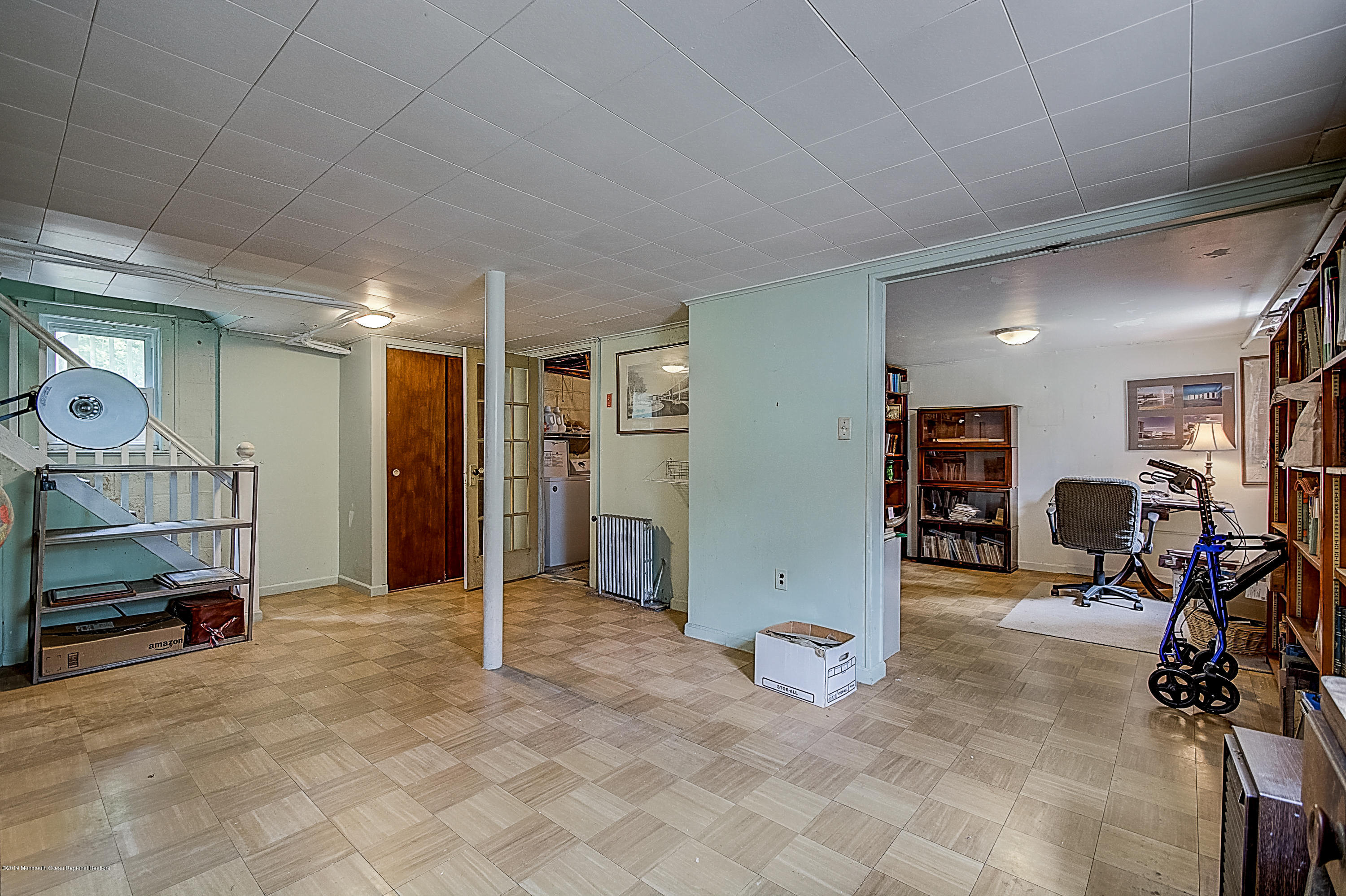 137 Pond Road Freehold, NJ 07728 - Photo 41 of 52 a view of a livingroom with furniture and a gym