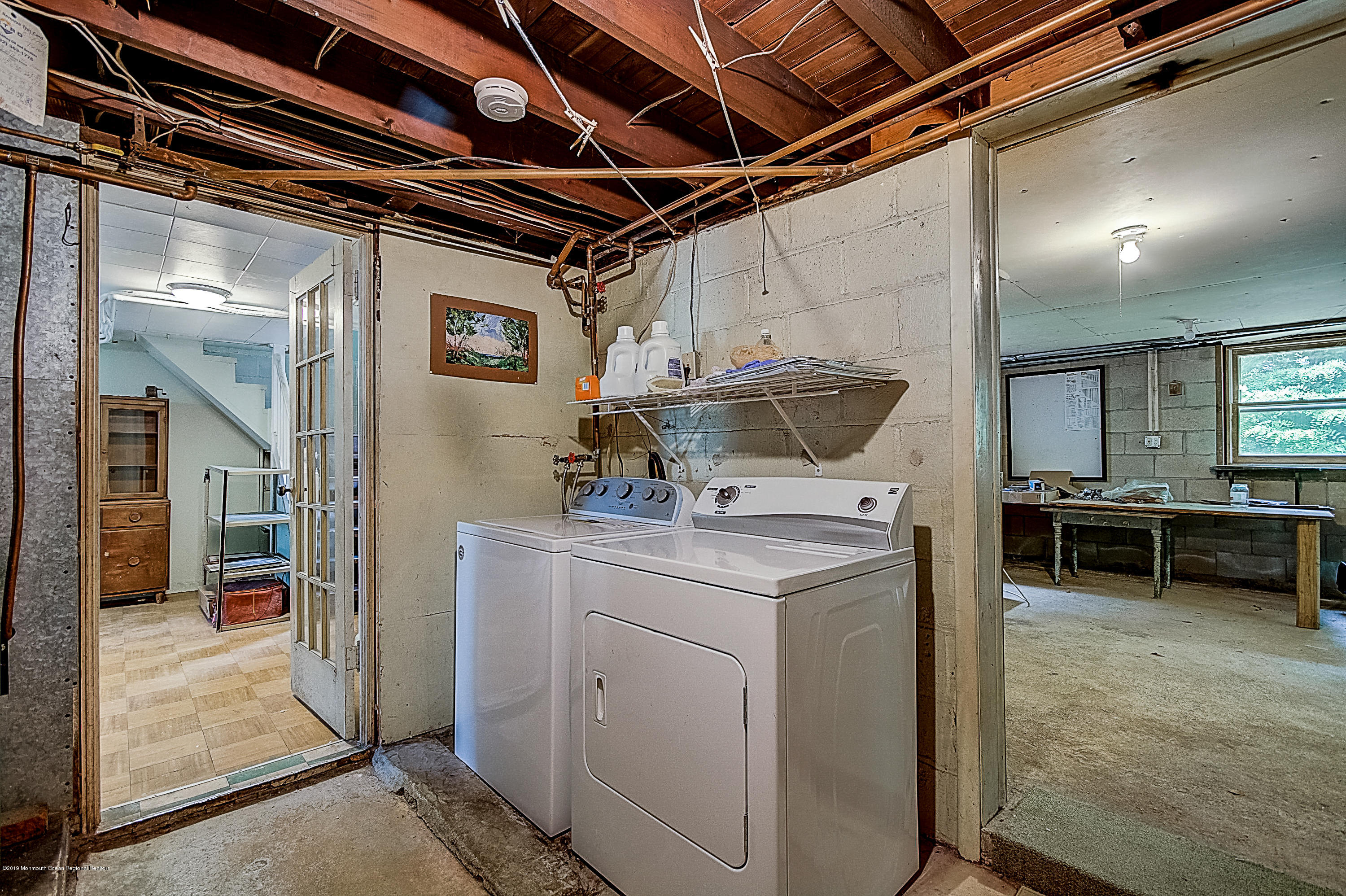 137 Pond Road Freehold, NJ 07728 - Photo 44 of 52 a utility room with dryer and washer