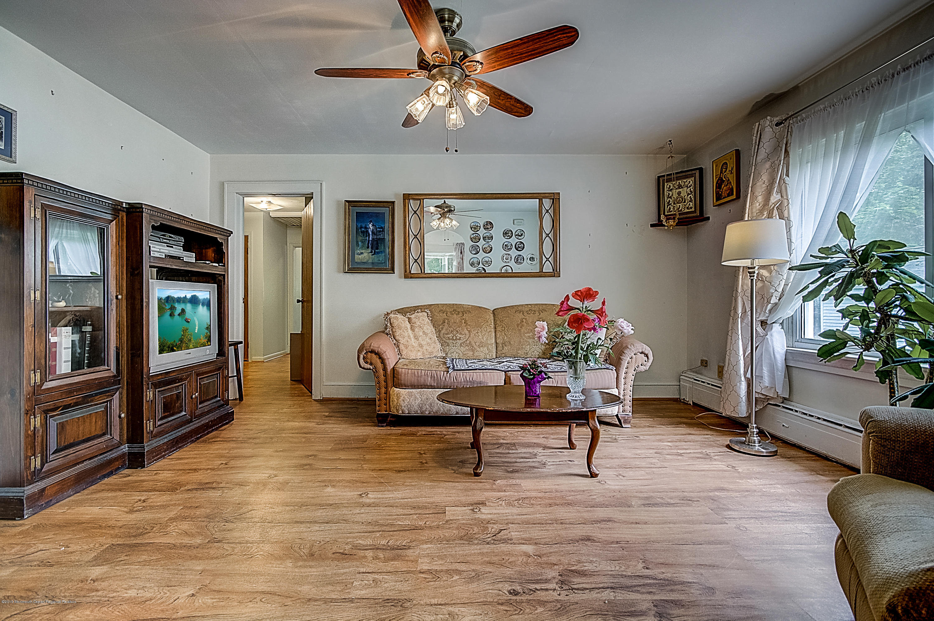 137 Pond Road Freehold, NJ 07728 - Photo 5 of 52 a living room with furniture and a flat screen tv