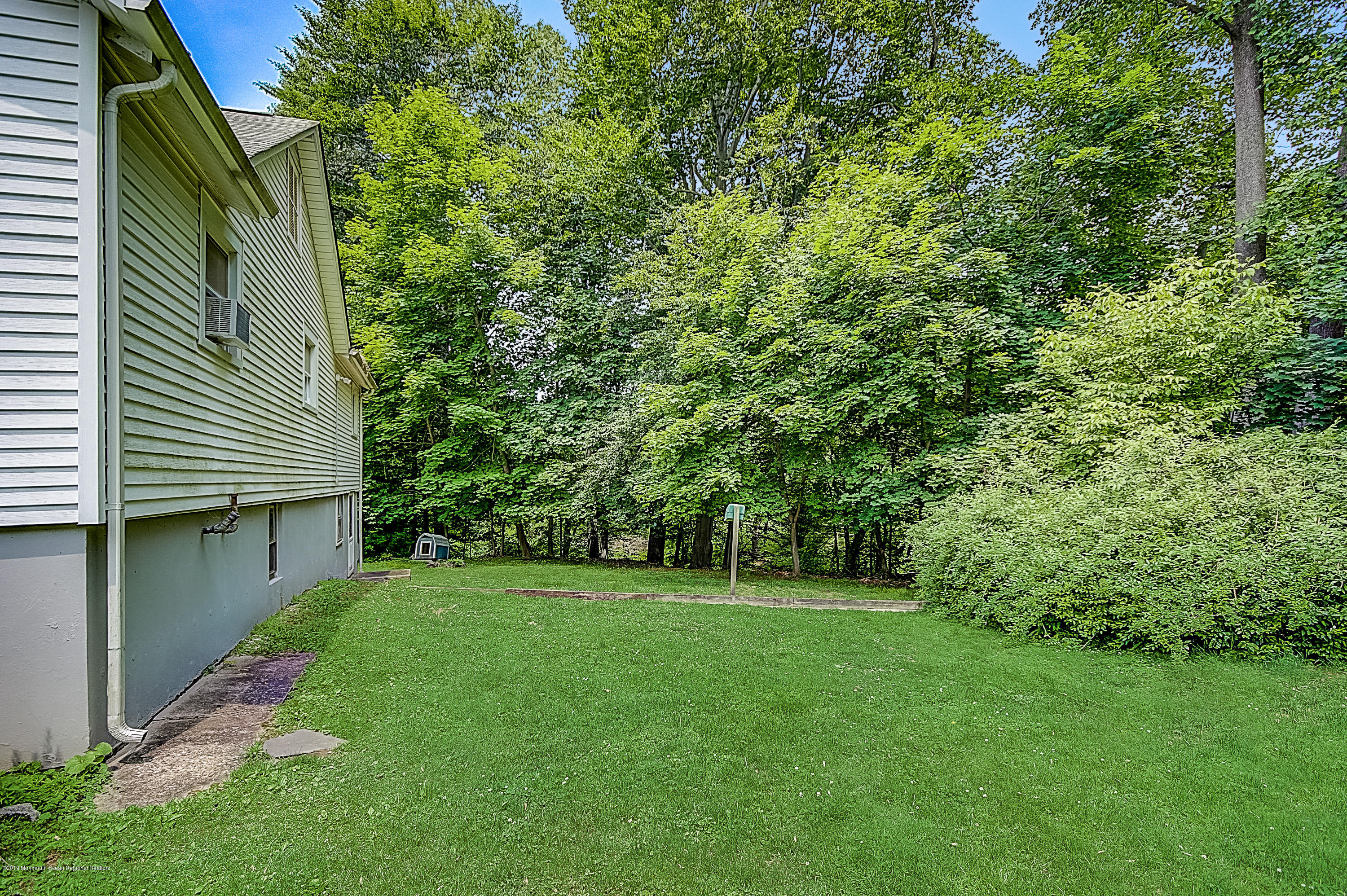 137 Pond Road Freehold, NJ 07728 - Photo 52 of 52 a view of a backyard with a garden