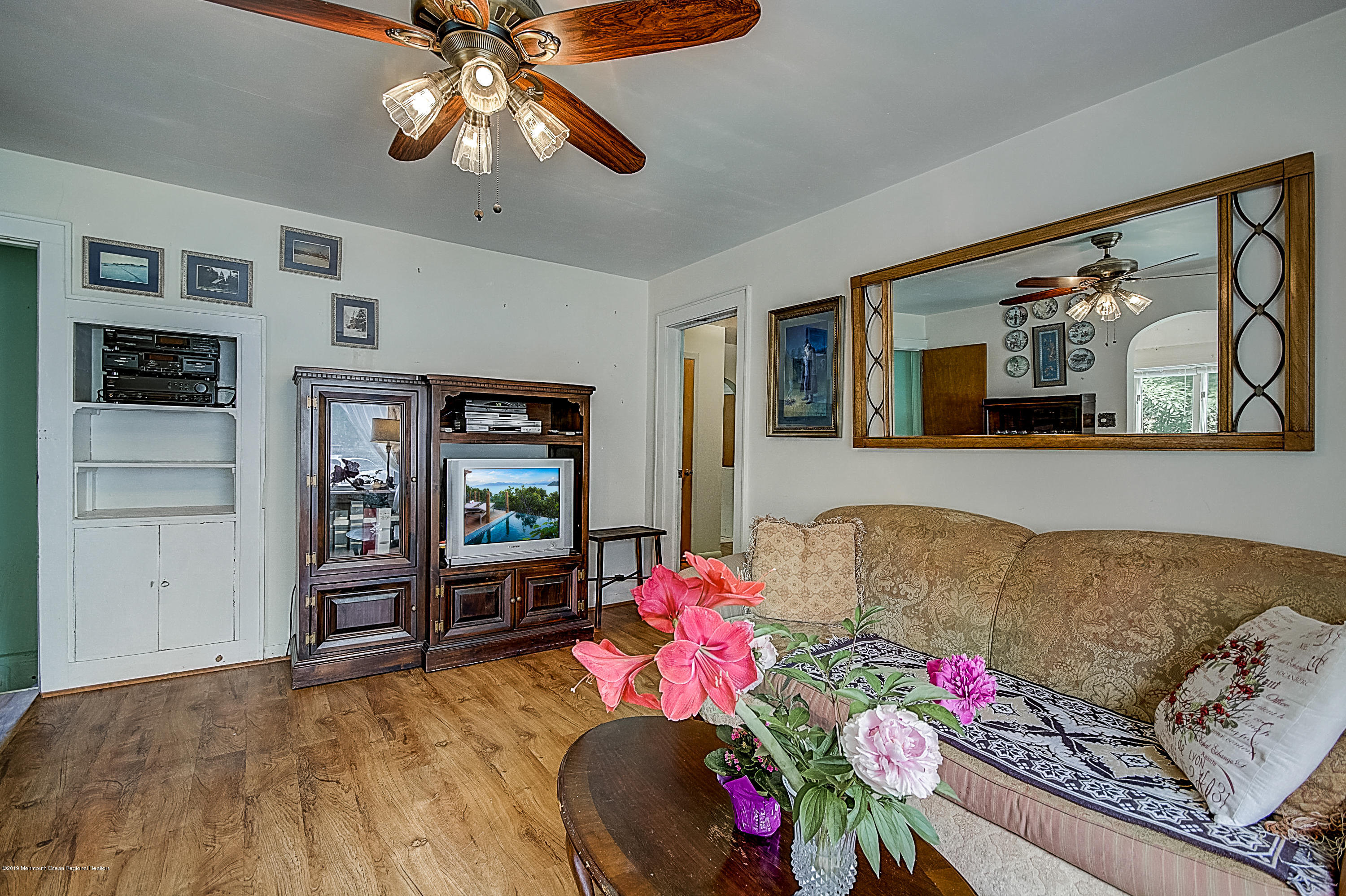 137 Pond Road Freehold, NJ 07728 - Photo 6 of 52 a living room with furniture and wooden floor