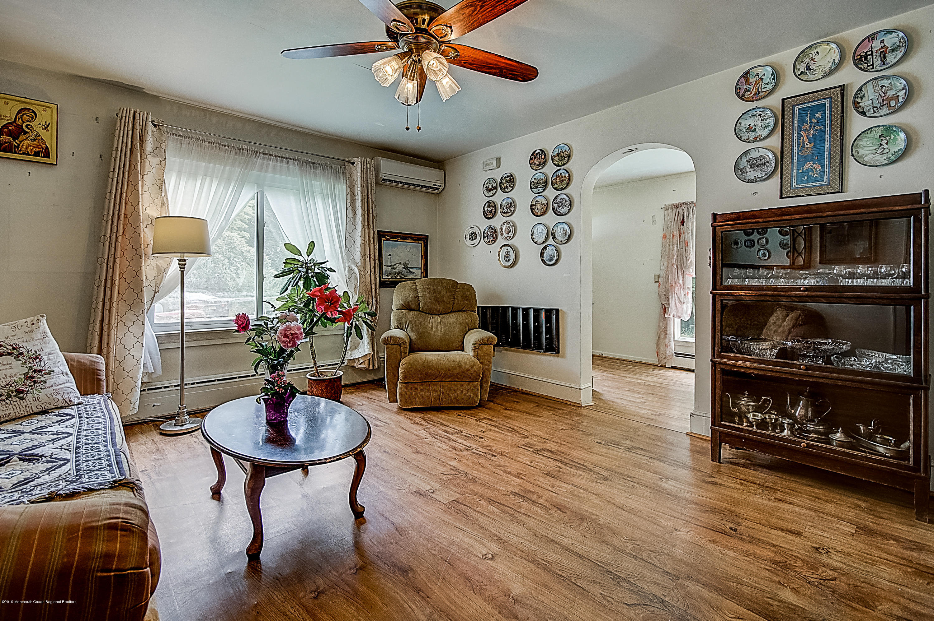 137 Pond Road Freehold, NJ 07728 - Photo 8 of 52 a living room with furniture and wooden floor