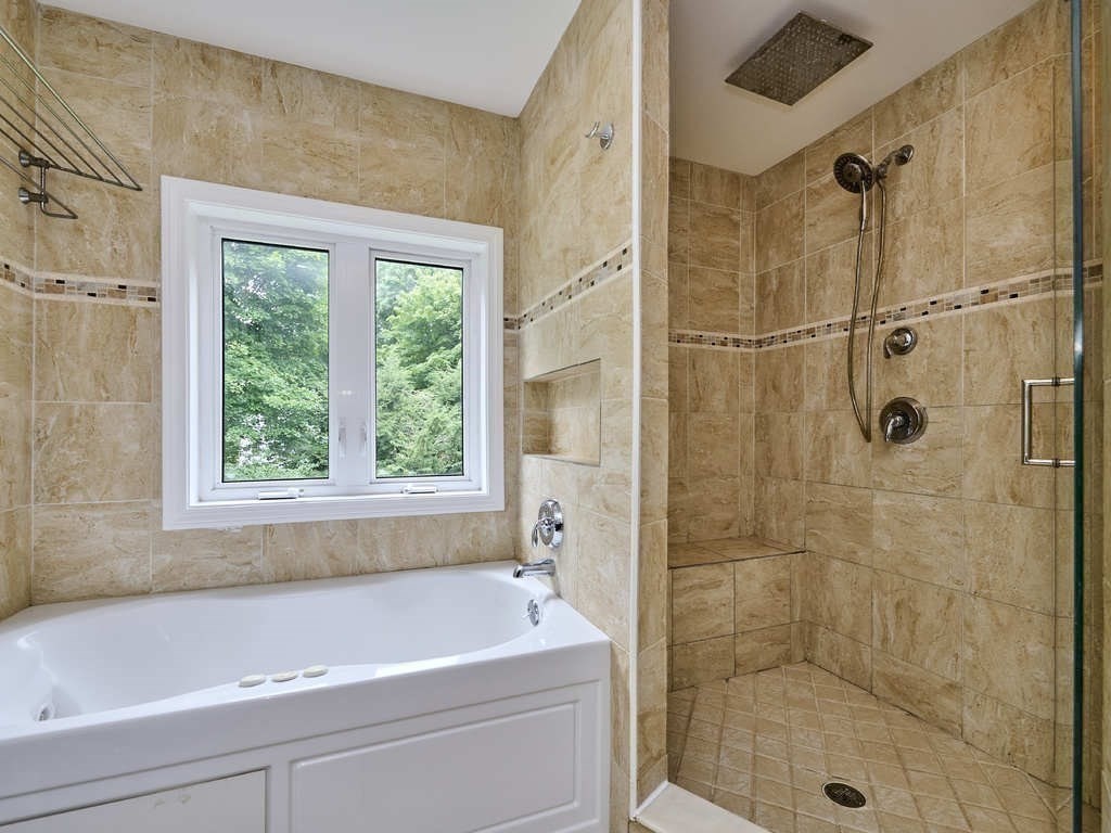33 Theodore Road Newton, MA 02459 - Photo 19 of 42 a bath tub sitting next to a shower