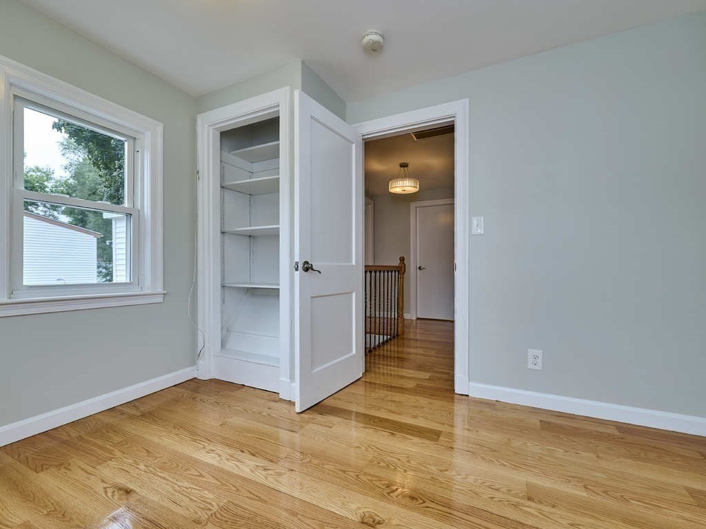 33 Theodore Road Newton, MA 02459 - Photo 27 of 42 a view of empty room with wooden floor and fan