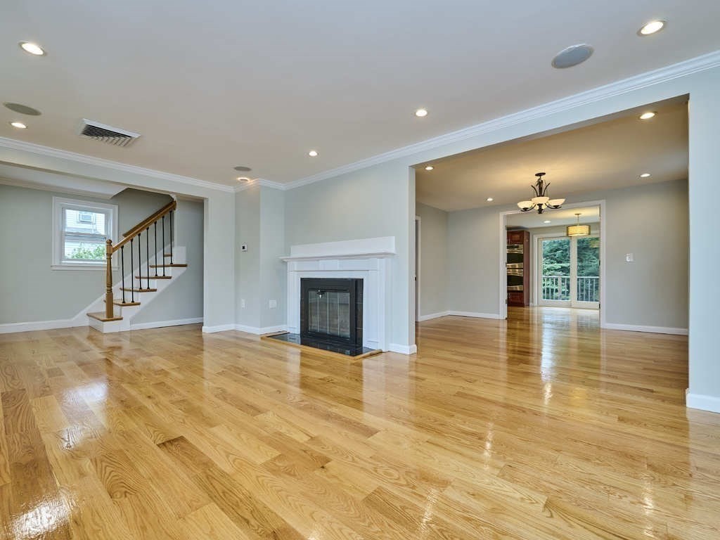 33 Theodore Road Newton, MA 02459 - Photo 3 of 42 a view of an empty room with fireplace and a window