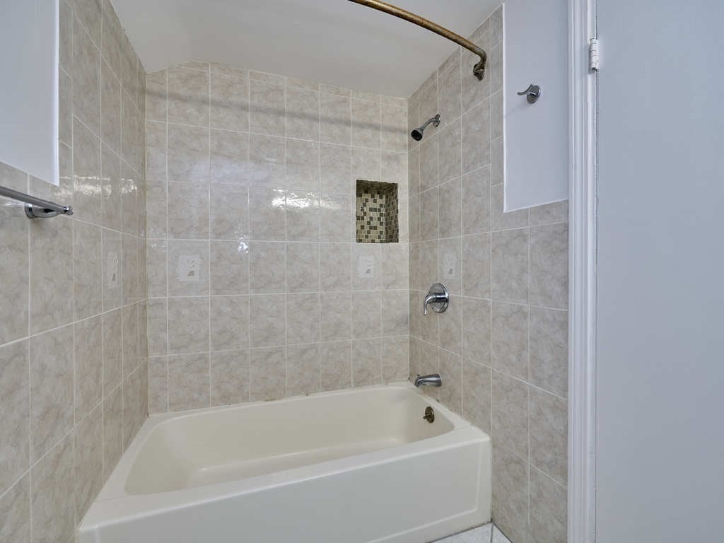 33 Theodore Road Newton, MA 02459 - Photo 31 of 42 a white bath tub sitting next to a shower