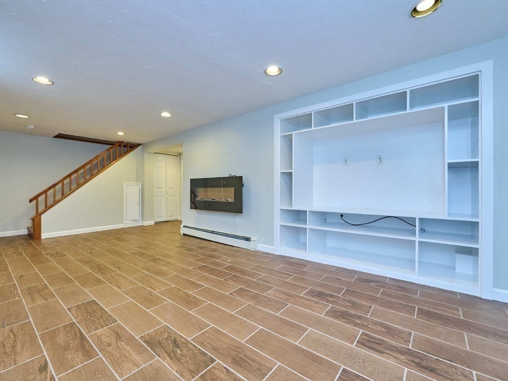 33 Theodore Road Newton, MA 02459 - Photo 33 of 42 a view of a livingroom with an empty space & a window