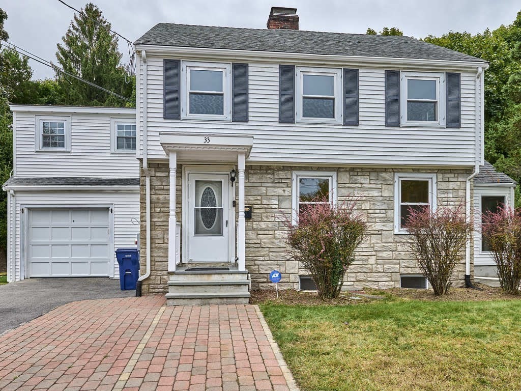 33 Theodore Road Newton, MA 02459 - Photo 38 of 42 a front view of a house with a yard