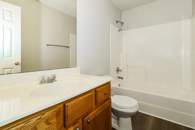 a bathroom with a sink a toilet and a bathtub