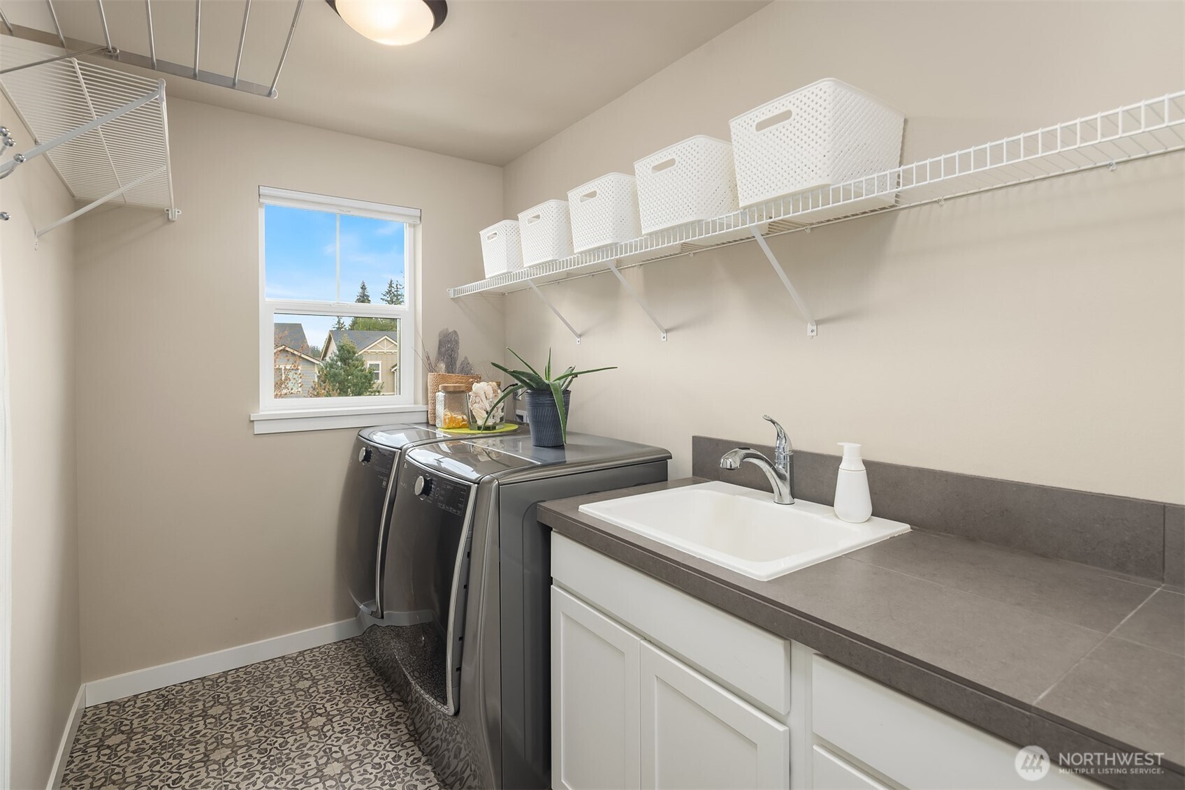1435 242nd Place Southeast Bothell, WA 98021 - Photo 36 of 40 a utility room with sink dryer and washer