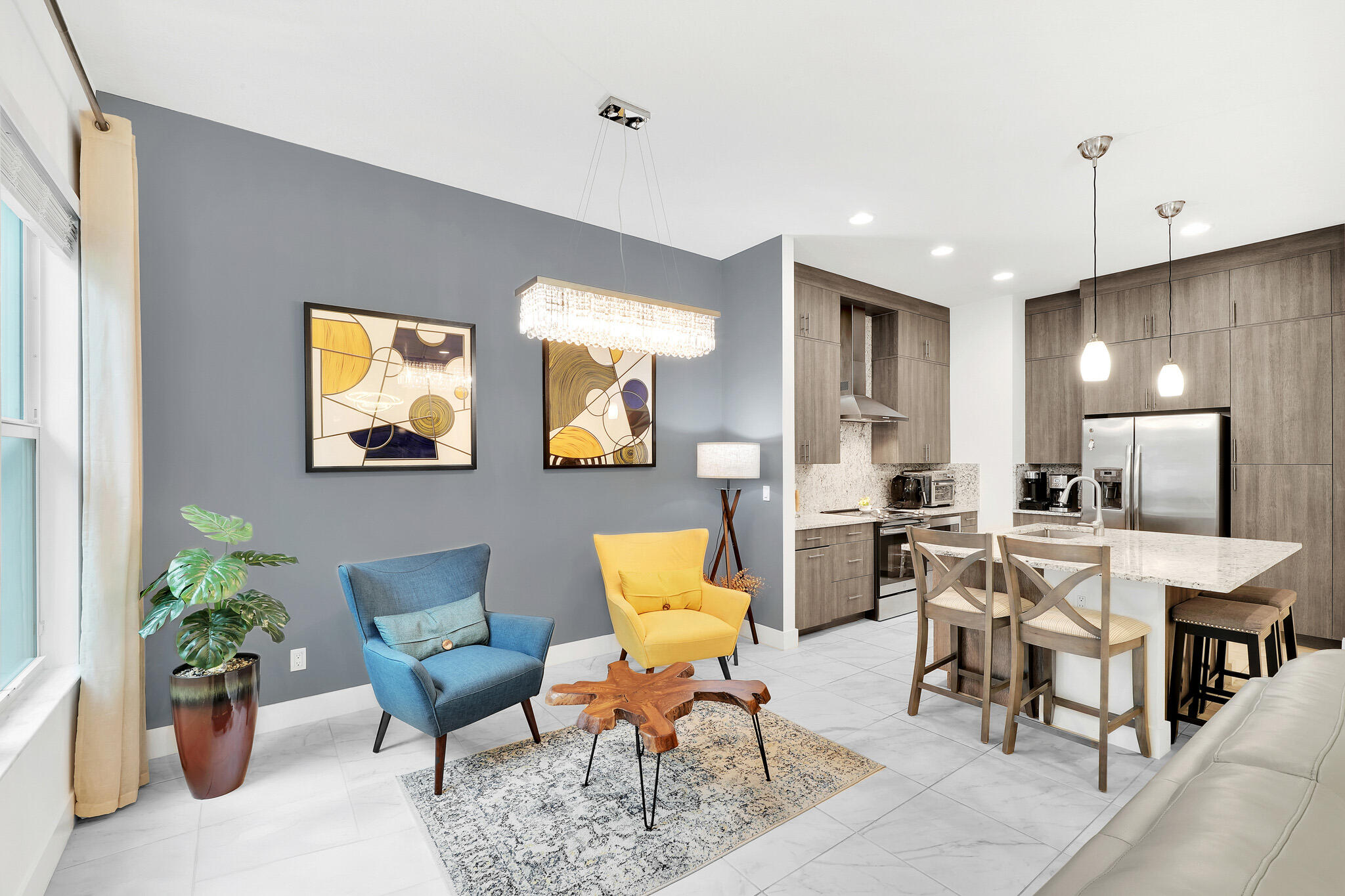 4821 Pointe Midtown Road Palm Beach Gardens, FL 33418 - Photo 11 of 62 a living room with furniture potted plant and open kitchen view
