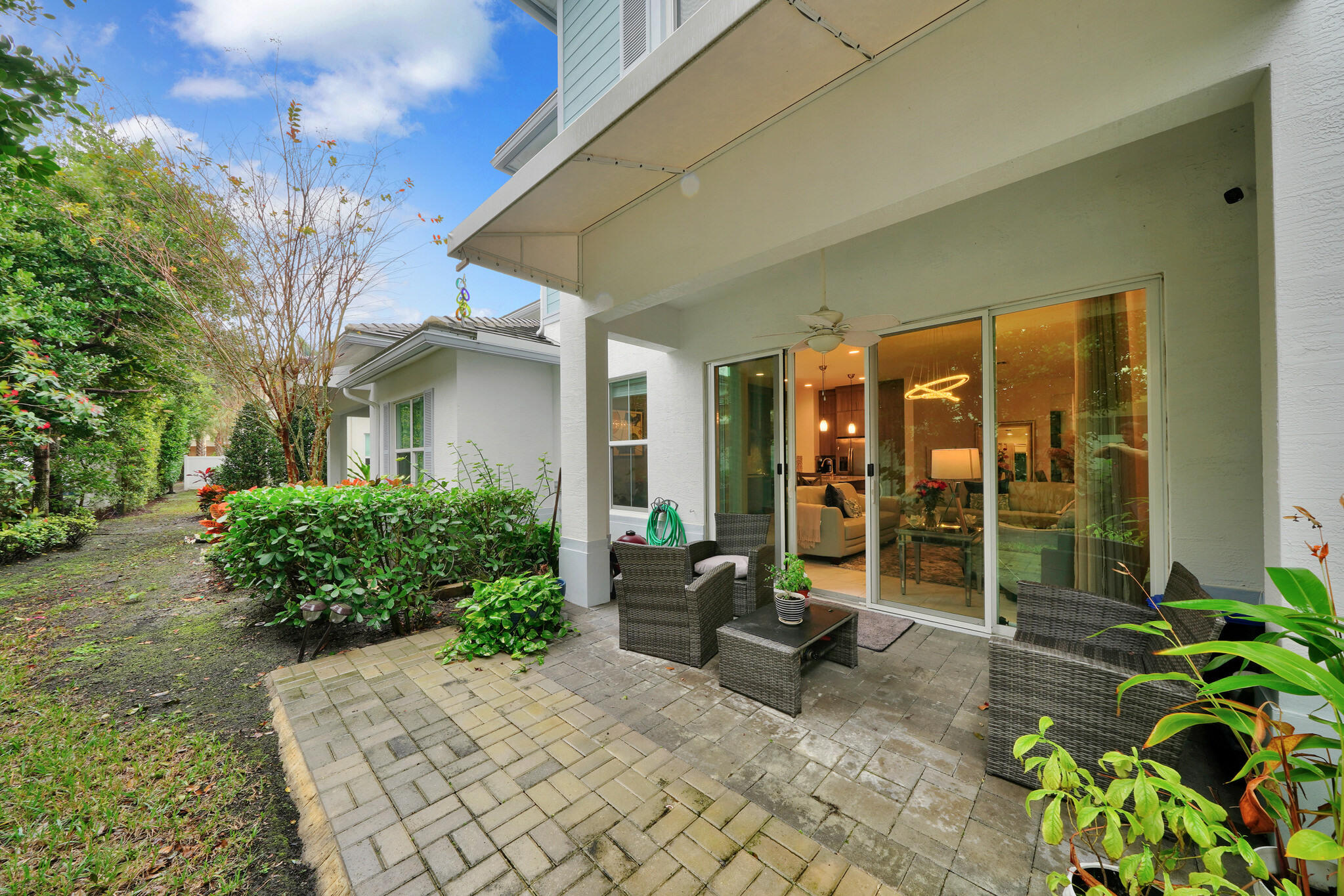 4821 Pointe Midtown Road Palm Beach Gardens, FL 33418 - Photo 13 of 62 a view of a house with backyard and sitting area