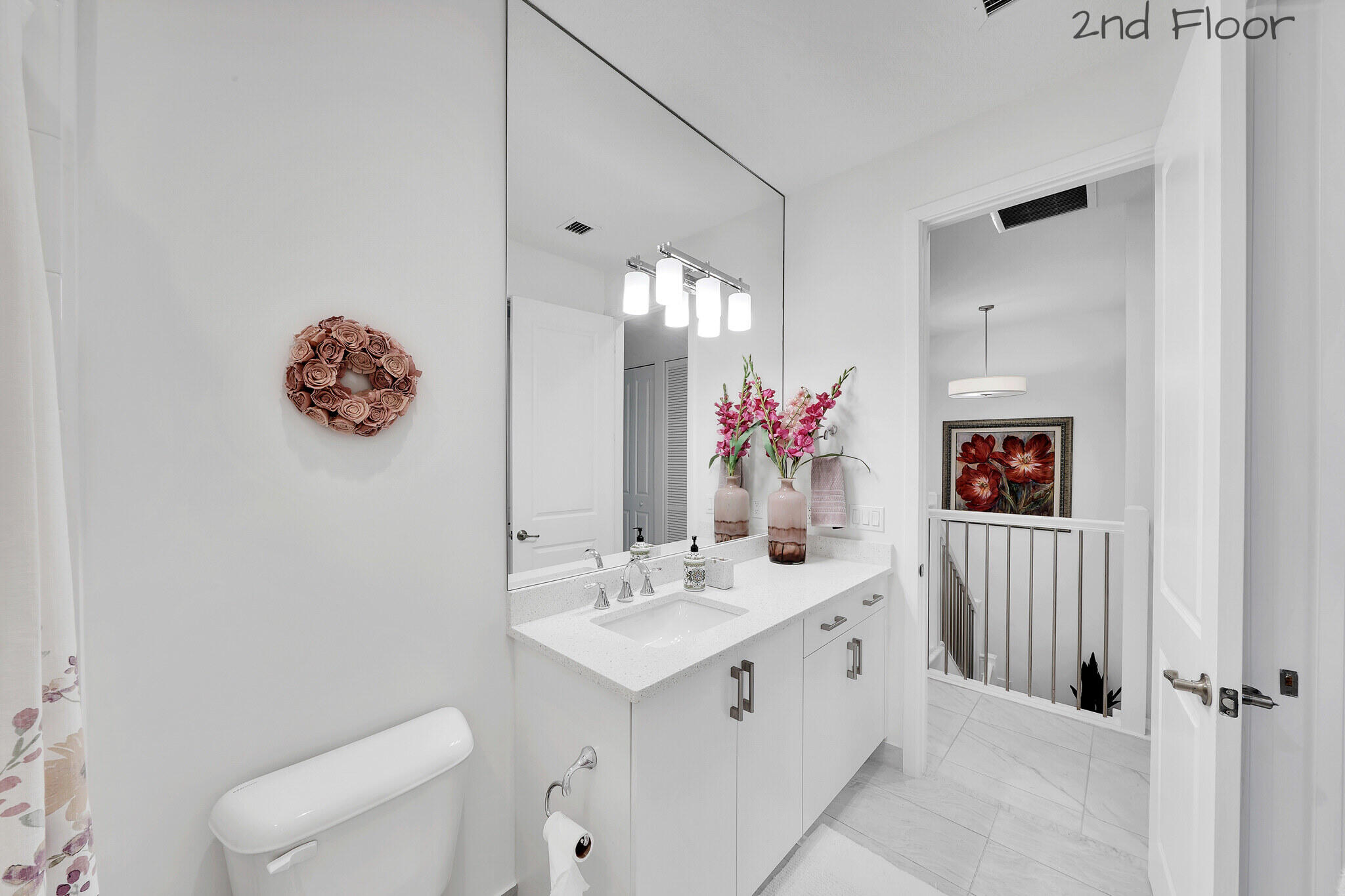 4821 Pointe Midtown Road Palm Beach Gardens, FL 33418 - Photo 22 of 62 a bathroom with a sink vanity and a mirror