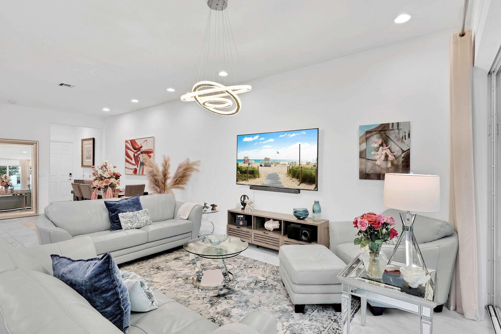 4821 Pointe Midtown Road Palm Beach Gardens, FL 33418 - Photo 3 of 62 a living room with furniture and a wooden floor