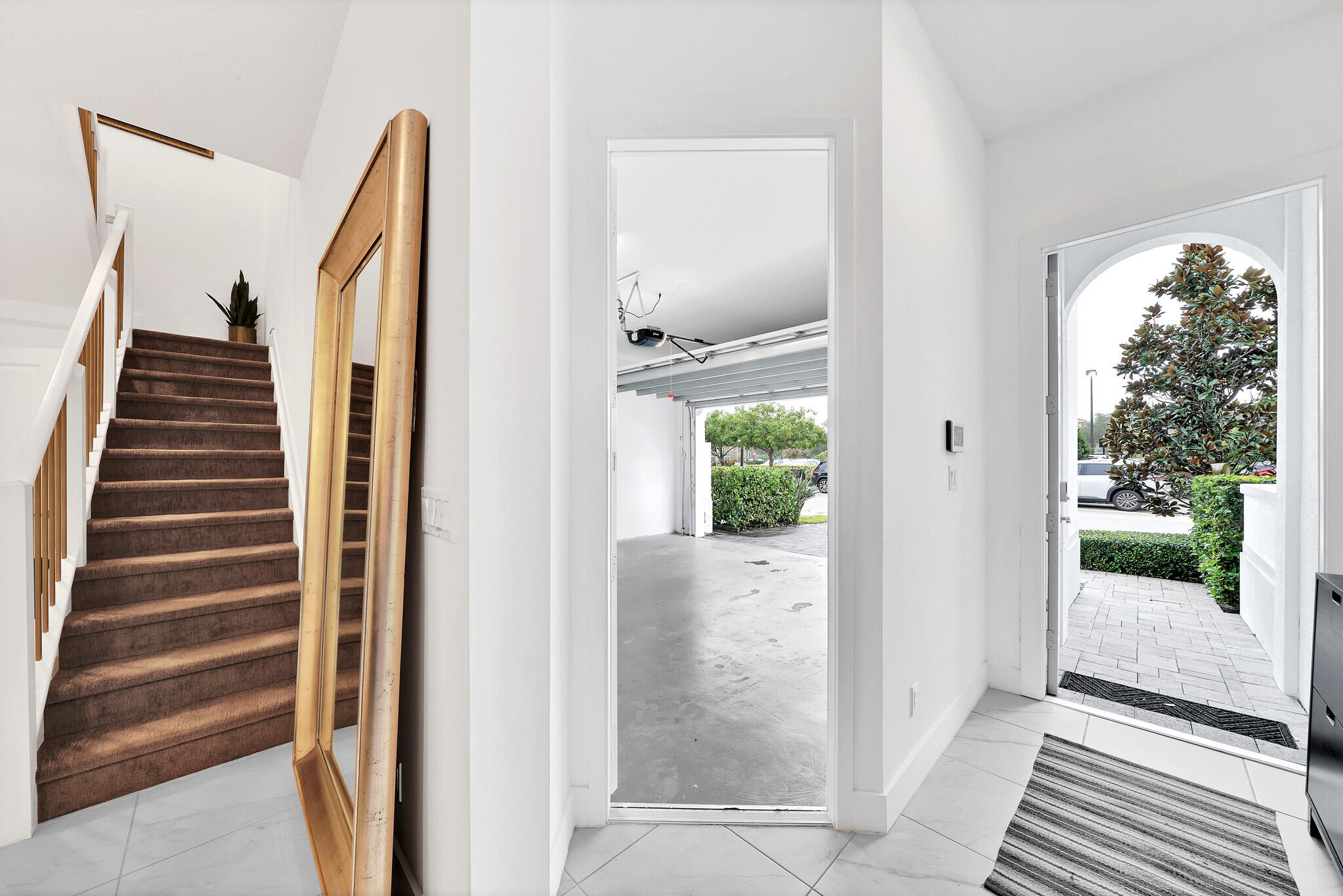 4821 Pointe Midtown Road Palm Beach Gardens, FL 33418 - Photo 45 of 62 a view of a hallway with windows and entryway