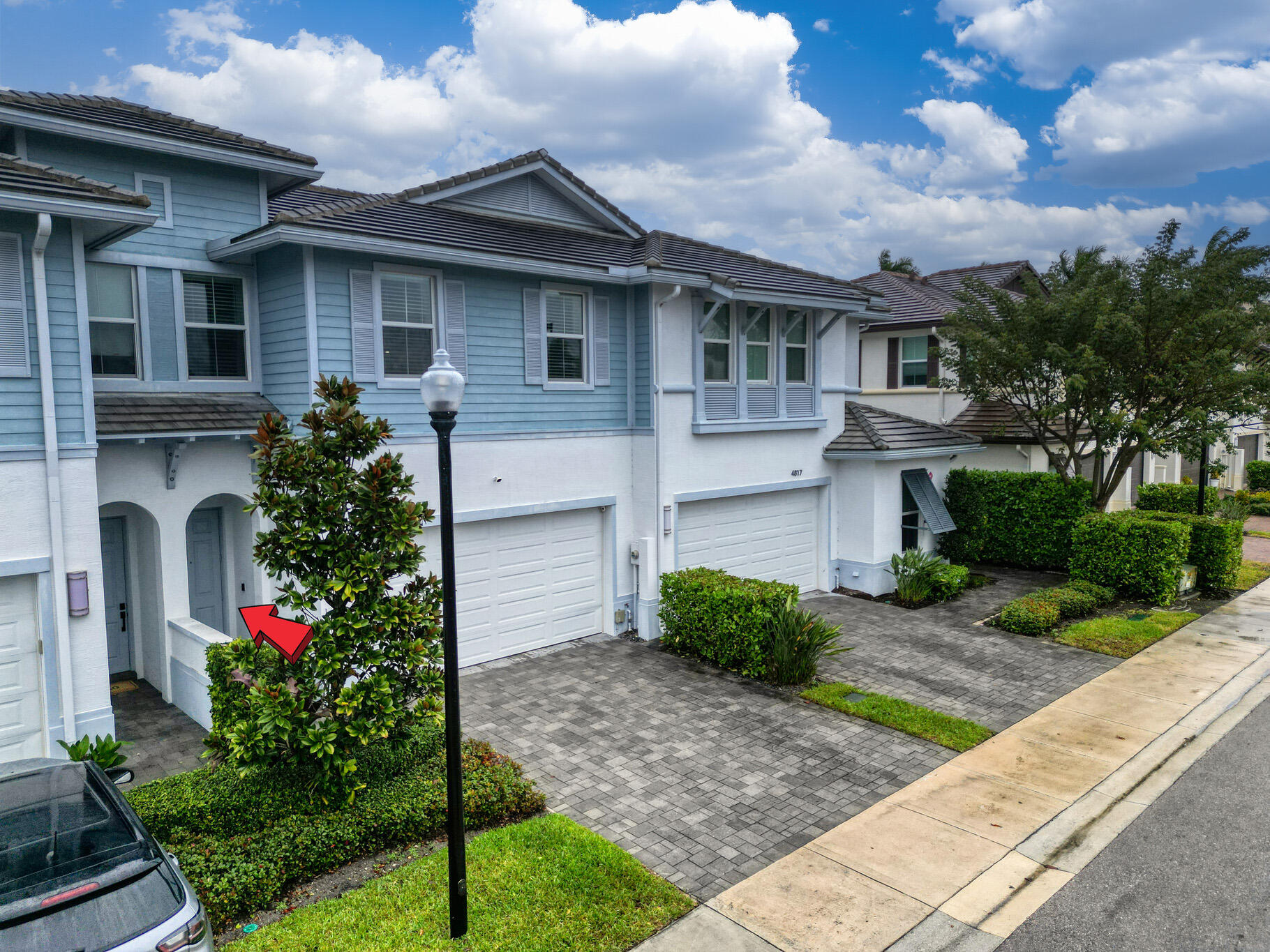 4821 Pointe Midtown Road Palm Beach Gardens, FL 33418 - Photo 47 of 62 a front view of a house with a garden