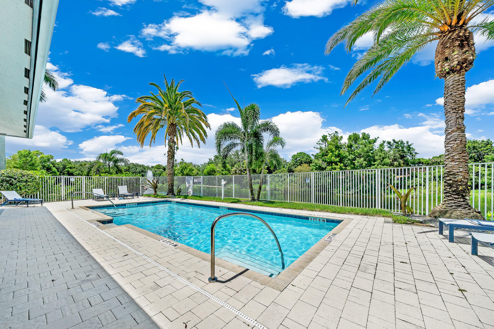 4821 Pointe Midtown Road Palm Beach Gardens, FL 33418 - Photo 5 of 62 a view of a backyard with swimming pool