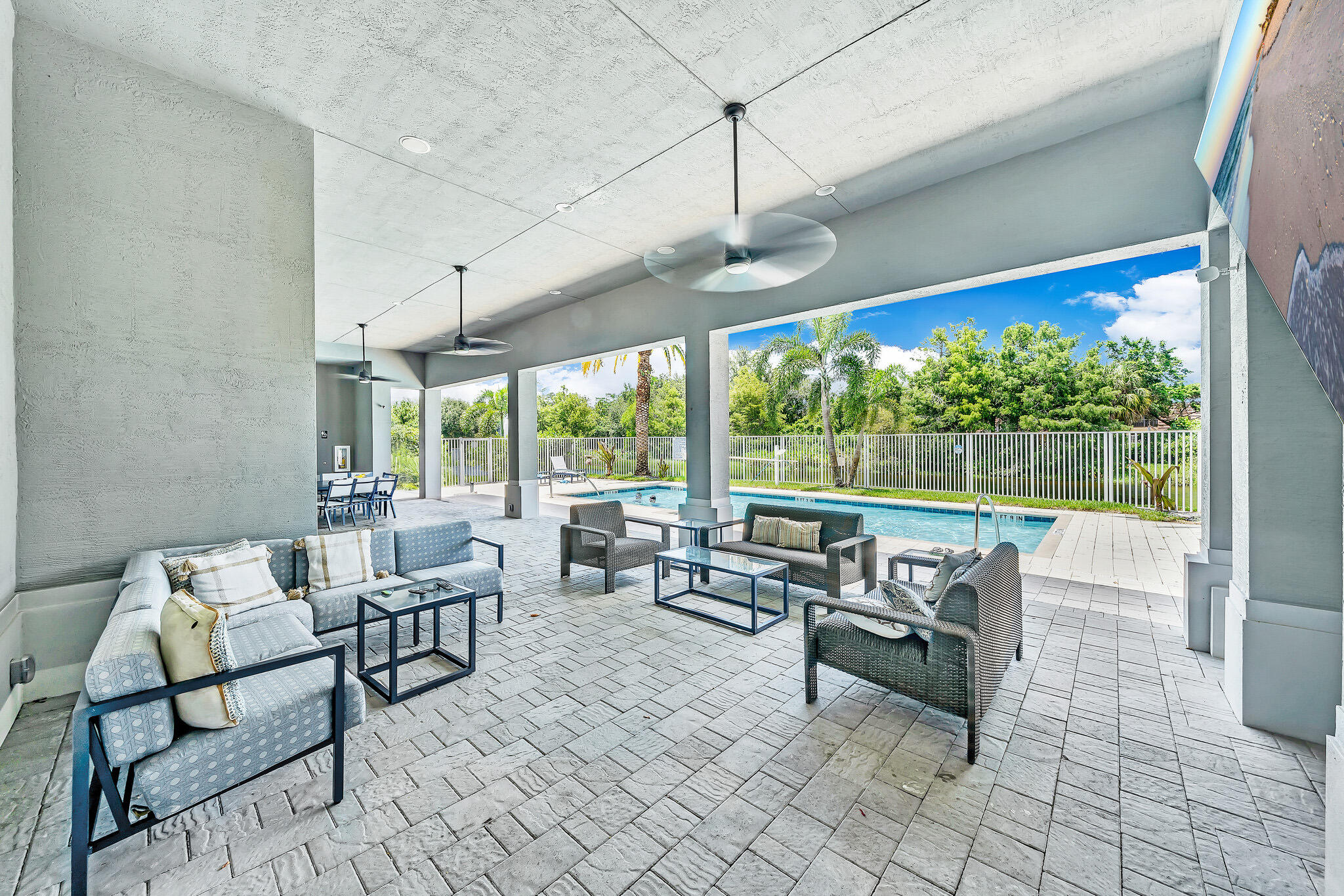 4821 Pointe Midtown Road Palm Beach Gardens, FL 33418 - Photo 58 of 62 a living room with furniture and a floor to ceiling window