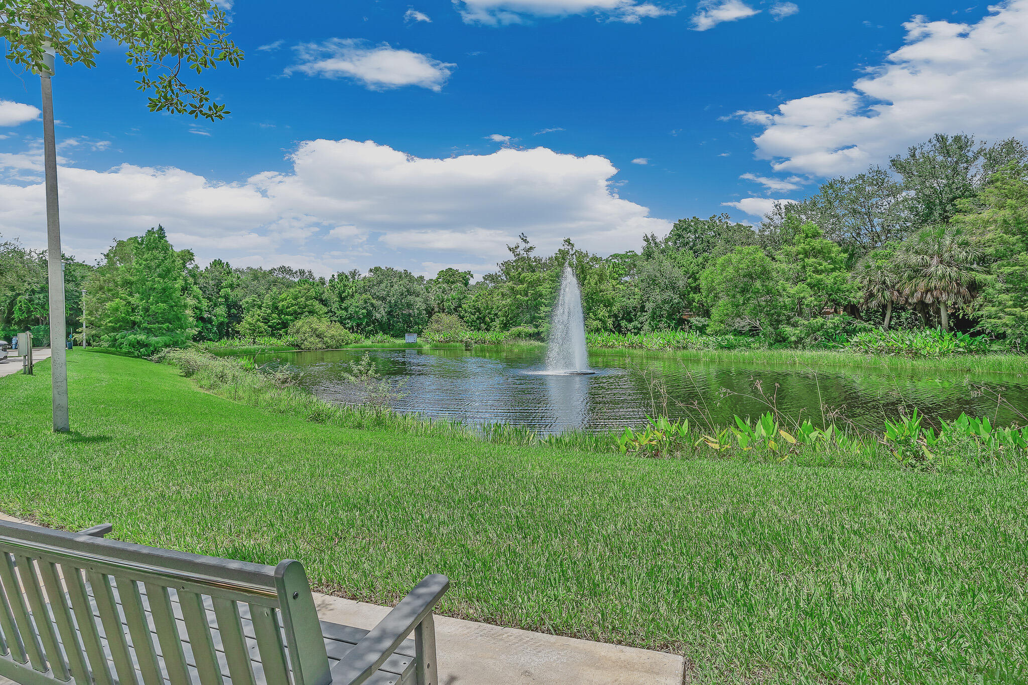 4821 Pointe Midtown Road Palm Beach Gardens, FL 33418 - Photo 60 of 62 a view of a lake with a yard
