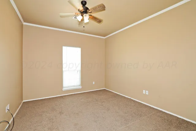 a view of a livingroom with a chandelier fan