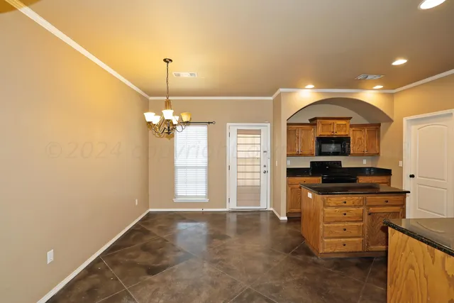 a view of a kitchen cabinets and a wooden floor