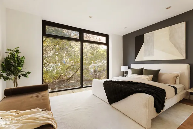 a kitchen with a table chairs sink and cabinets