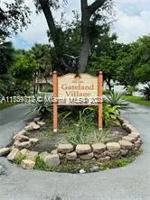 a view of a wooden fence next to a road