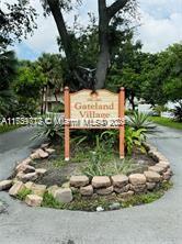 a view of a wooden fence next to a road