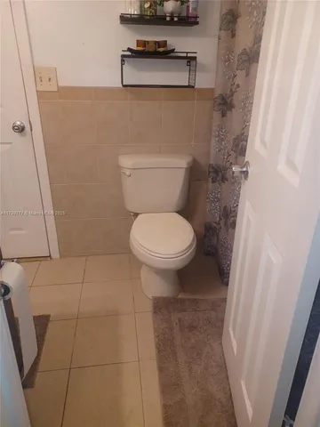 a bathroom with a toilet and a sink