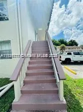 a view of entryway and car parked