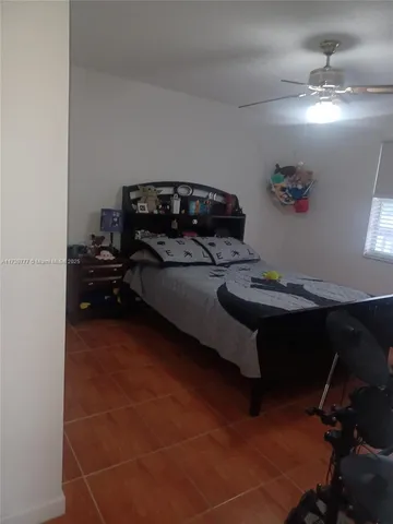a bedroom with a bed and a table in it