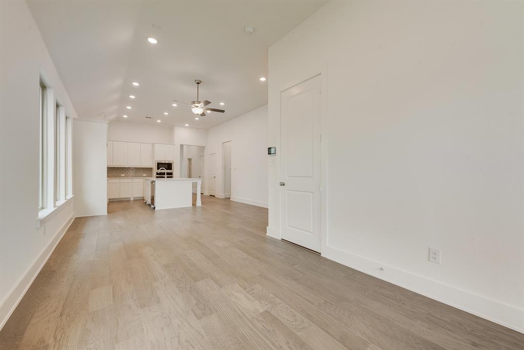 528 Embargo Drive Fate, TX 75189 - Photo 11 of 36 a view of a kitchen with a sink and a refrigerator