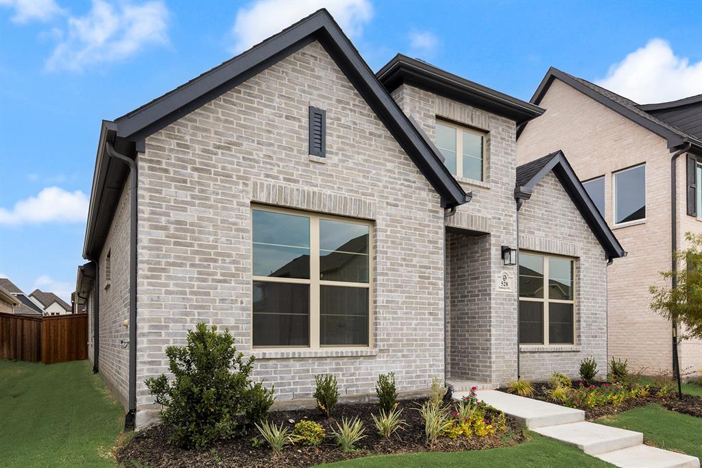 528 Embargo Drive Fate, TX 75189 - Photo 2 of 36 a front view of a house with a yard