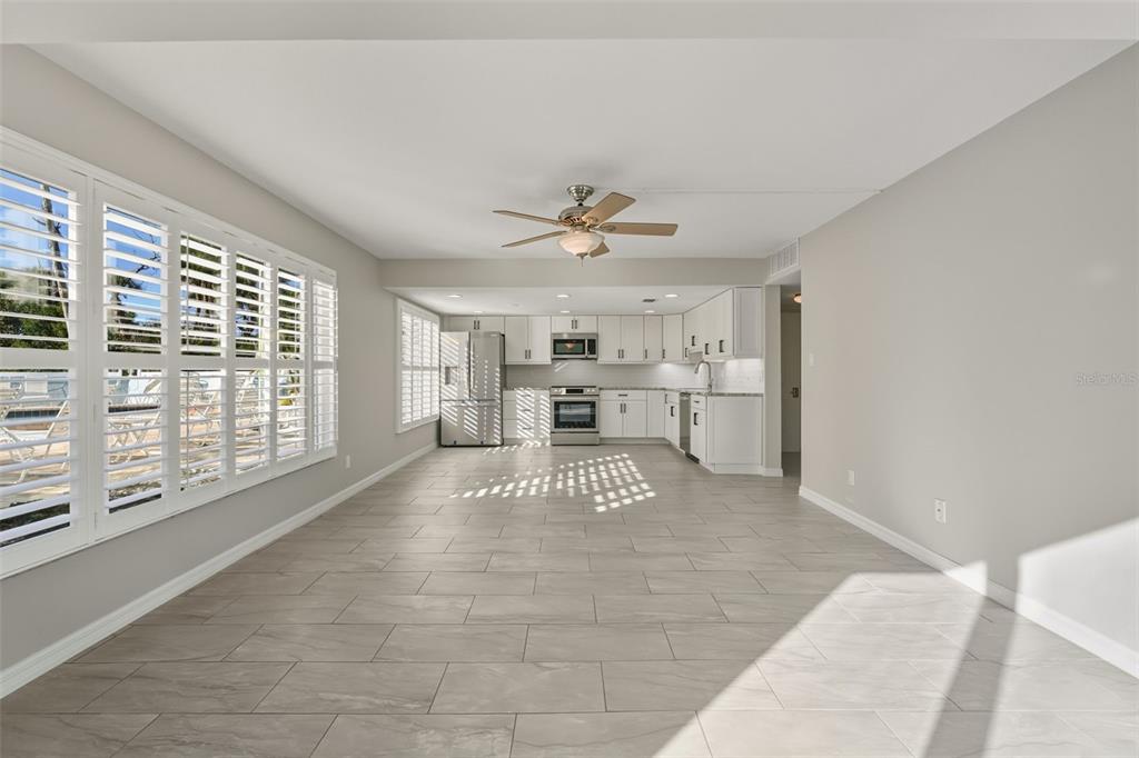 5055 North Beach Road, Unit 108 Englewood, FL 34223 - Photo 12 of 36 a view of an empty room with a window