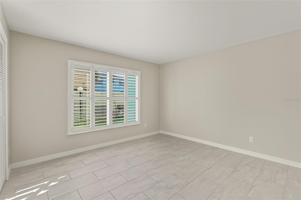 5055 North Beach Road, Unit 108 Englewood, FL 34223 - Photo 20 of 36 an empty room with a window