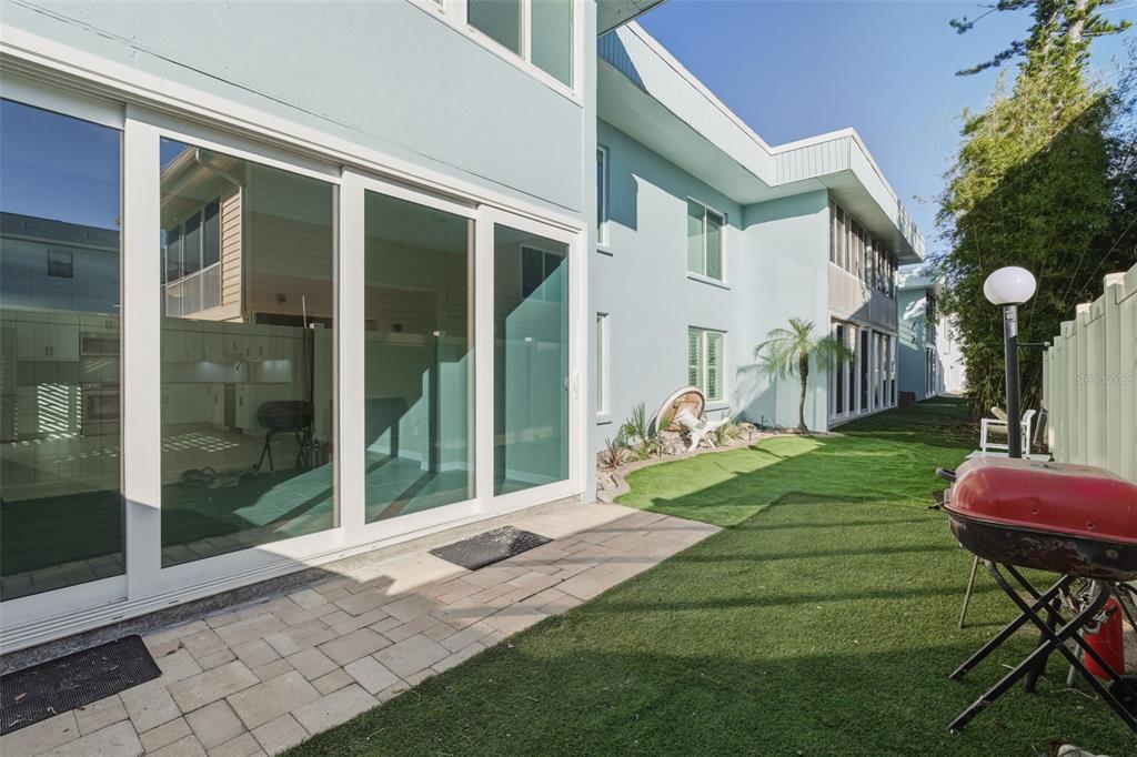 5055 North Beach Road, Unit 108 Englewood, FL 34223 - Photo 27 of 36 a front view of a house with a yard table and chairs