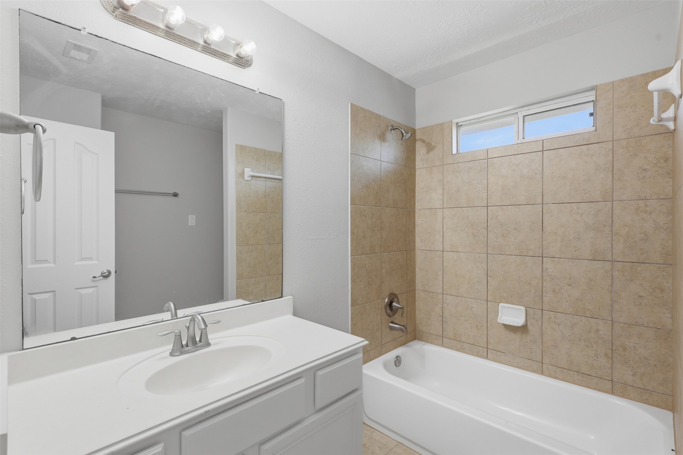 25926 Morgan Springs Spring, TX 77373 - Photo 35 of 49 The upstairs full bathroom features a spacious vanity, tub and shower combination, and neutral finishes, providing comfort and convenience for family members and guests alike.