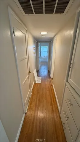 a view of entryway with wooden floor