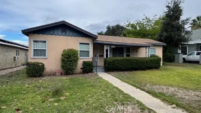 a front view of a house with a yard and porch