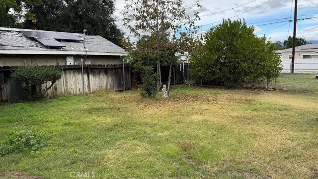 a backyard of a house with lots of green space
