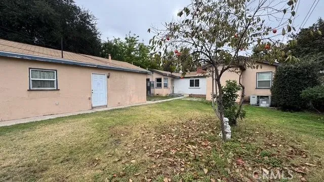 a house with trees in the background